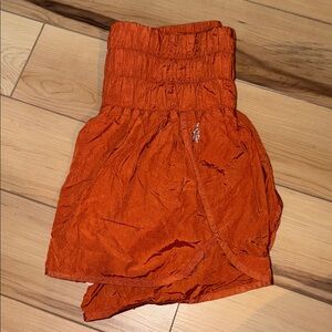 FP Movement by Free People Bright Orange Smocked Shorts